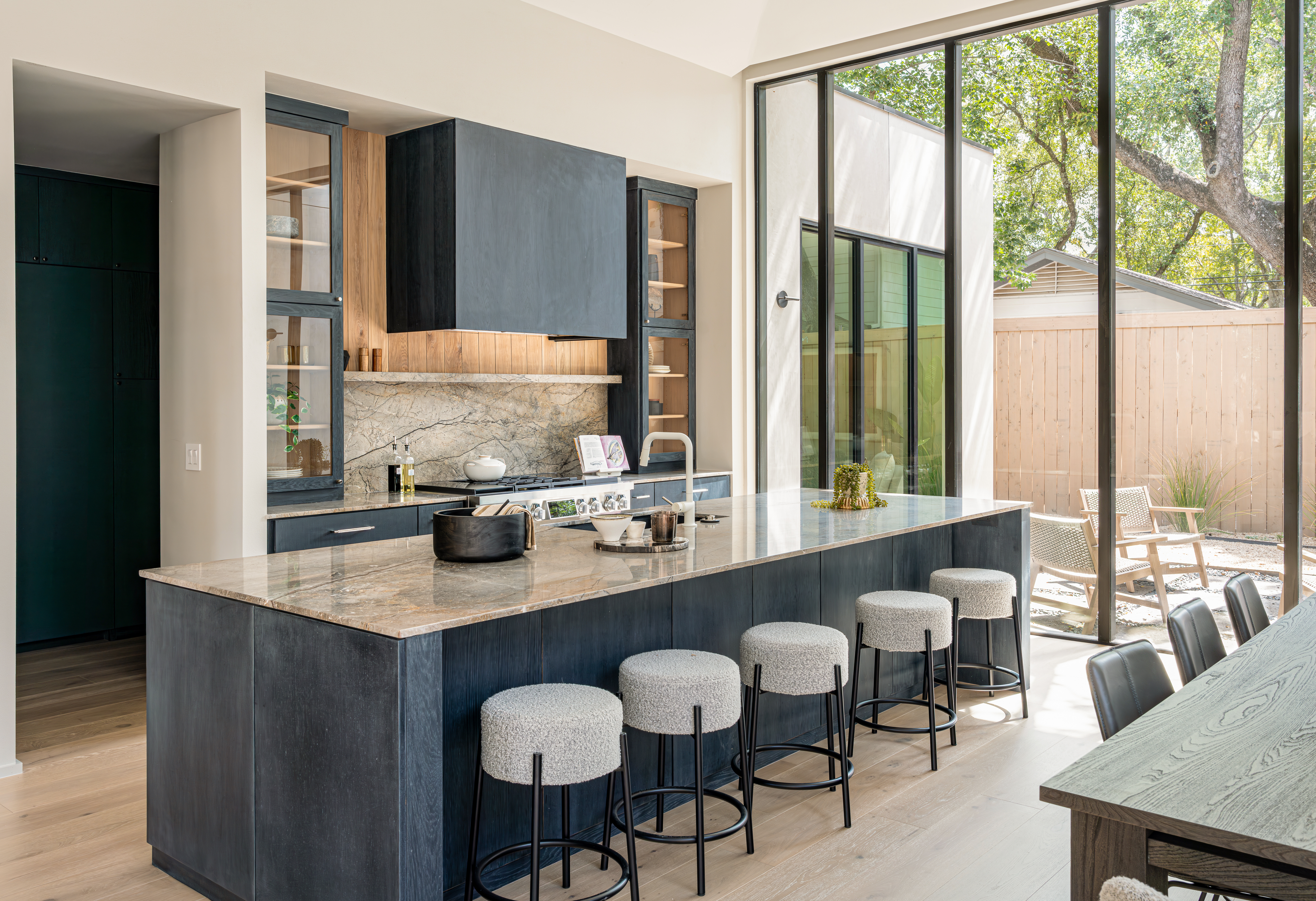 Elegant modern kitchen featuring a marble countertop installed by Allied Gallery Austin, in a luxury home built by Monsier Luxury Homes in Austin, TX