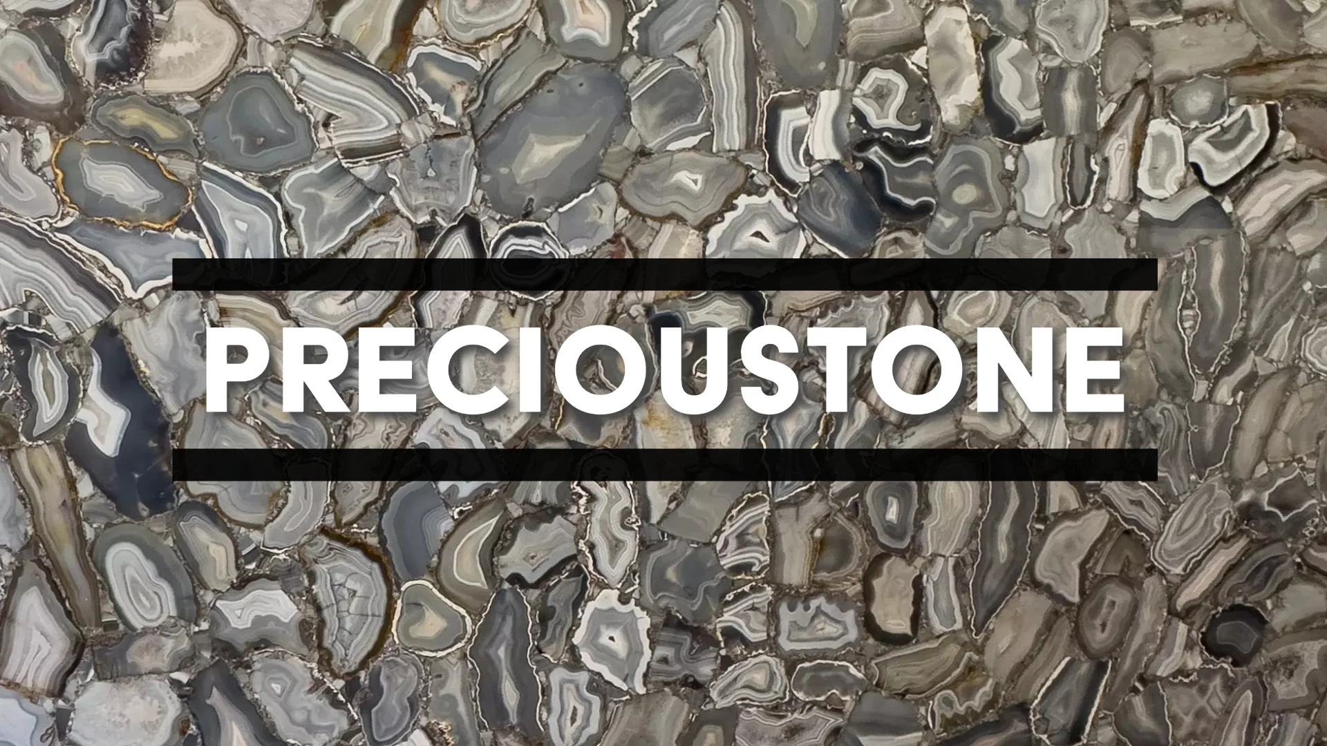 Close-up of a beautiful precioustone slab featuring dynamic gray circle formations, available from Allied Gallery, Texas's leading Precioustone fabricator and installer